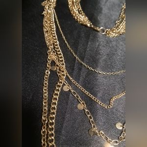 Gold tone long layered necklace 36 inches long.